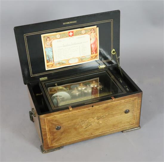 A late 19th century Swiss marquetry inlaid rosewood eight air musical box, 21in.